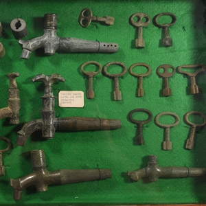 Cased Post Medieval Published Beer Tap and Key Collection