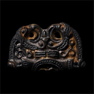 Pre-Viking Gilt Bronze Fitting with Mask Between Ravens