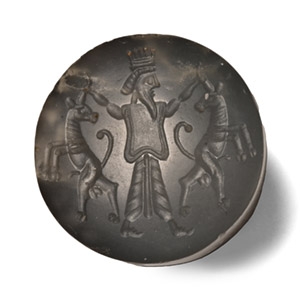 Persian Chalcedony Stamp Seal of a Persian King Gripping the Horns of Two Goats