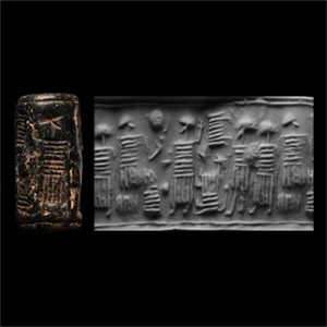 Anatolian Black Stone Cylinder Seal with Seated Figure Holding Cup Facing a Standing Figure