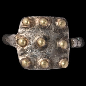 Western Asiatic Silver-Gilt Ring with Bosses