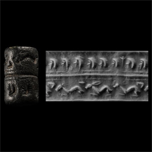 Syrian Black Stone Cylinder Seal with Human Heads