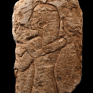 Egyptian Limestone Relief Fragment with Female Figure