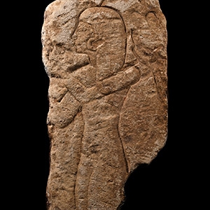Egyptian Limestone Relief Fragment with Female Figure