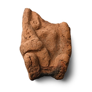 Egyptian Terracotta Fragment of Man Holding Elongated Phallus