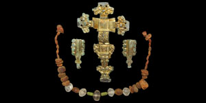 Gilt-Bronze Cruciform Brooch, Beads and Wrist Clasps Group
