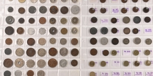 Group of One Hundred and Twenty-Nine [129] World Coins in Three Album Leafs.