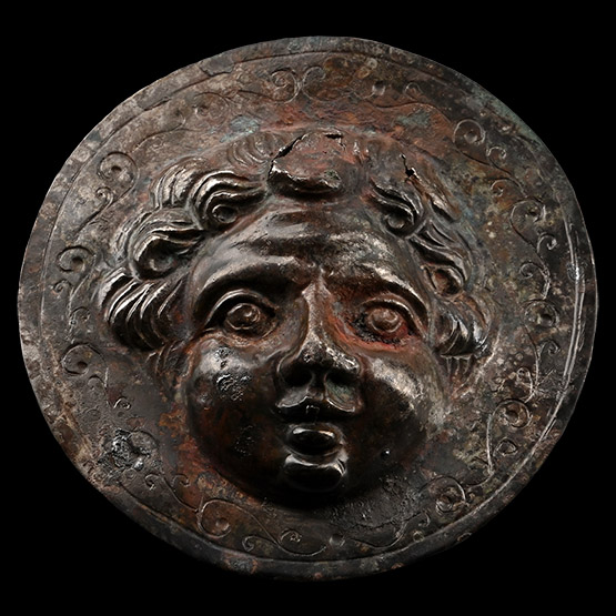Roman Silver Phalera with Face of Eros, the Greek God of Love
