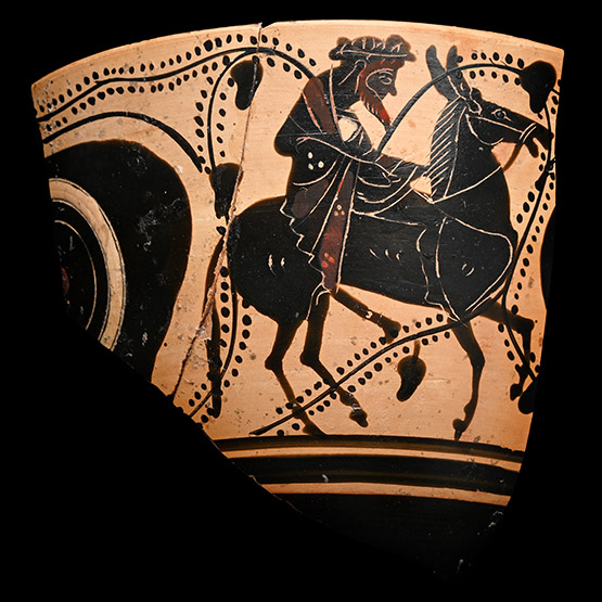 Greek Attic Black-Figure Eye Cup Fragment Depicting Dionysos Riding a Donkey