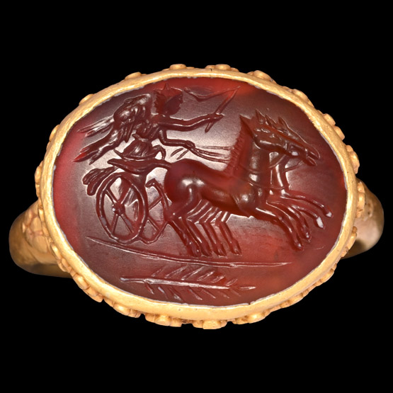 Post Medieval Gold Ring with Gemstone representing a Winged Victory Charioteer