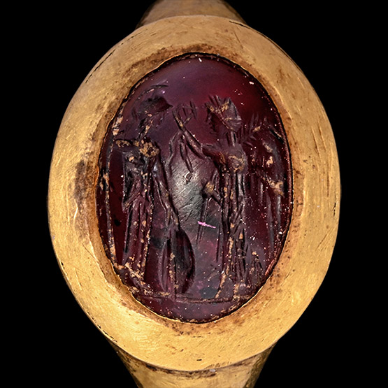 Roman Gold Ring with Cabochon Garnet Gemstone with the Goddesses Athena and Nike