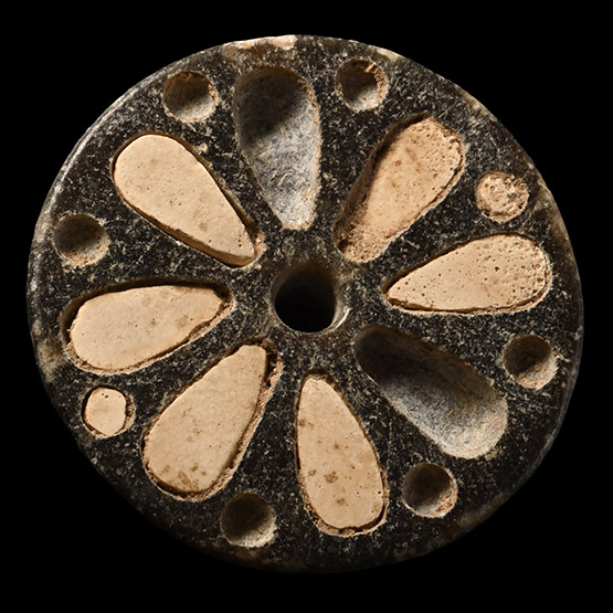 Western Asiatic Stone Flower Roundel with Inlays
