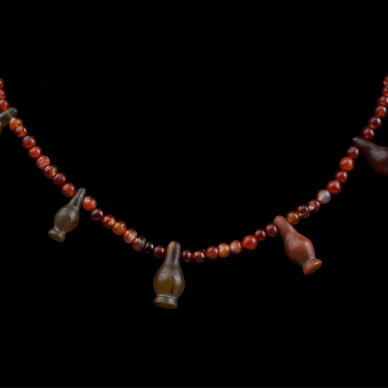 Egyptian Carnelian Bead and Poppy Amulet Necklace