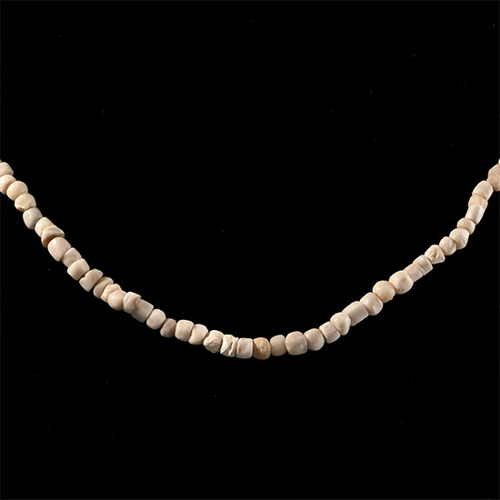 Western Asiatic Cream Glass and Other Bead Necklace String