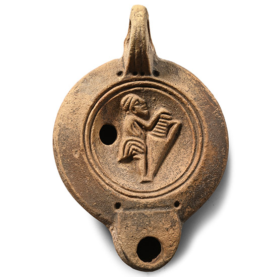 Roman Terracotta Oil Lamp with Figure Carrying an Amphora