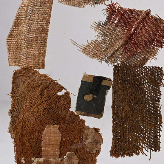 Egyptian Mummy Textile and Cartonnage Fragments in Display Stand
