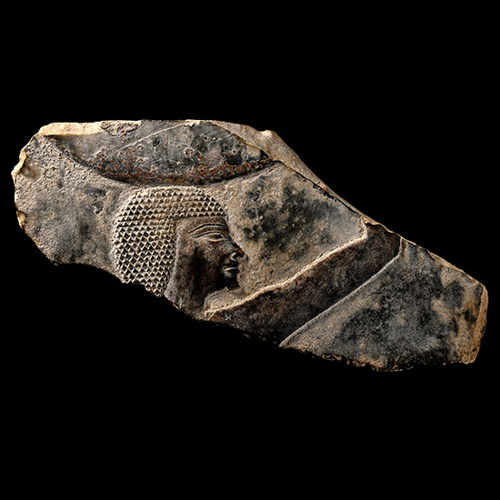 Egyptian Limestone Relief Fragment of a Man