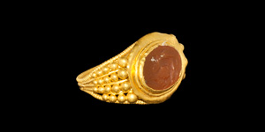 Gold and Carnelian Decorated Ring with Winged Putto Intaglio