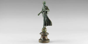 Roman Luna on Globe Statuette
