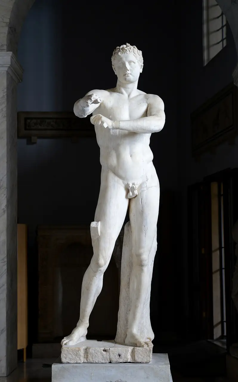 The Apoxyomenos, a marble athlete scraping down his outstretched arm