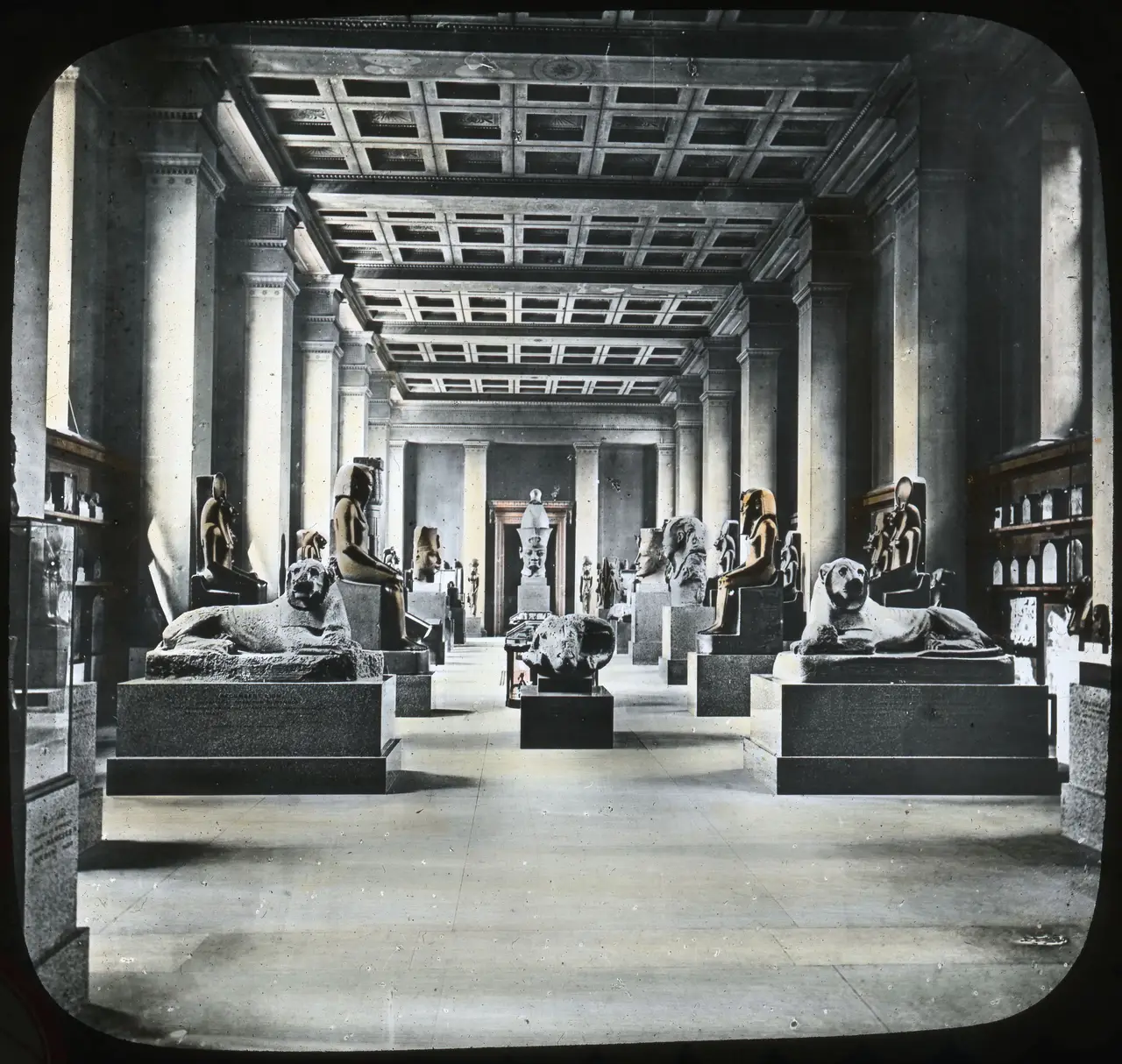 The Egyptian Sculpture Gallery of the British Museum lined with monumental statuary, about 1913