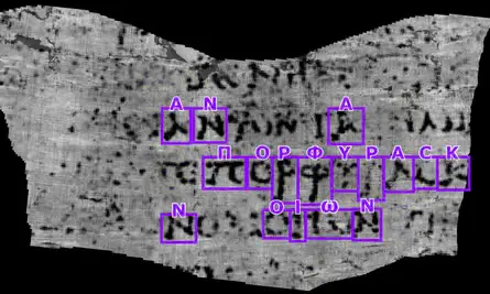 A flattened Herculaneum papyrus segment with the Greek word for purple detected and outlined