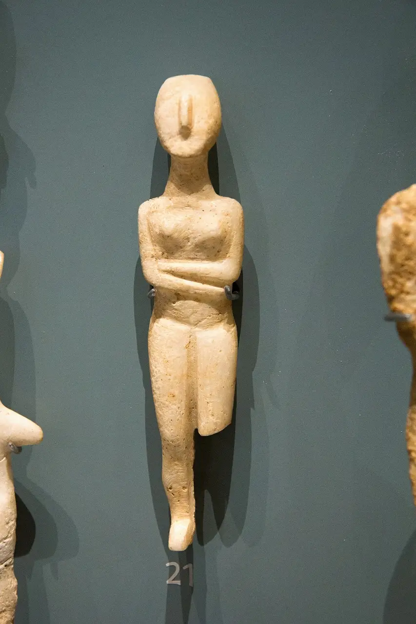 An Early Cycladic folded-arm marble figurine