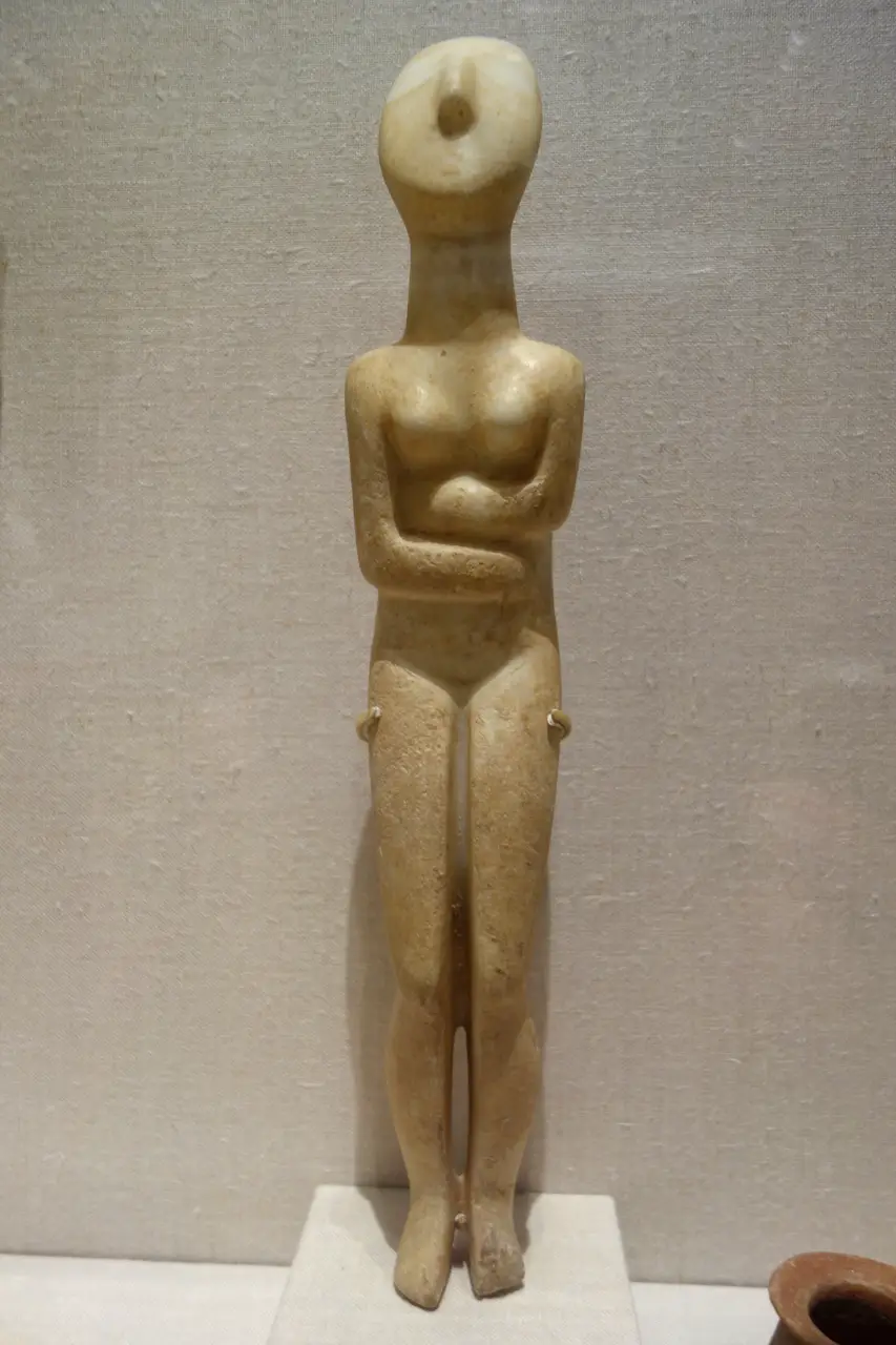 An Early Cycladic folded-arm marble figurine of the third millennium BC