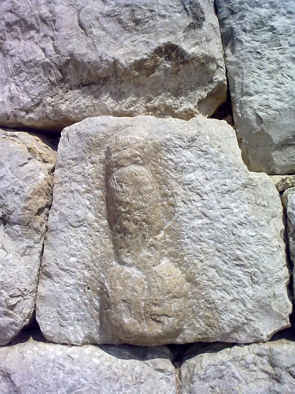 A phallus carved in relief into a wall block at the Roman town of Empúries