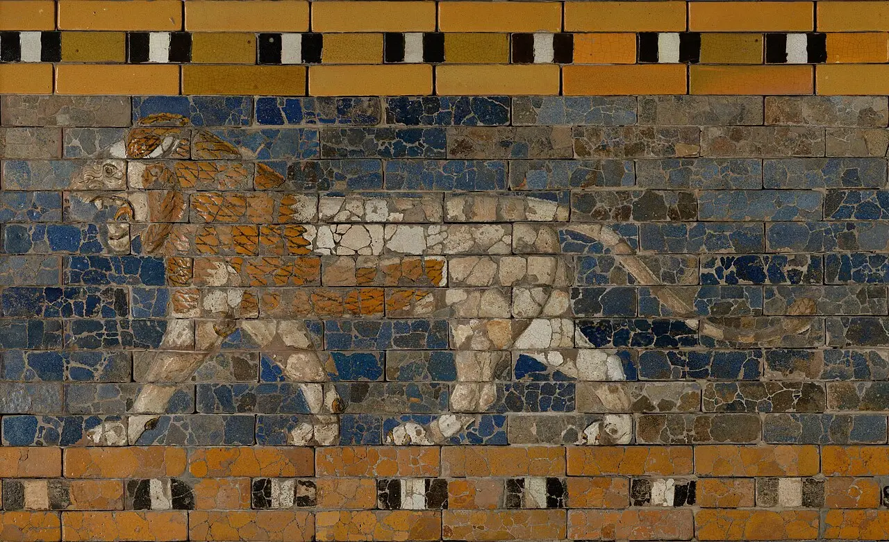 A striding lion in moulded relief on a deep blue glazed-brick ground from the Processional Way at Babylon