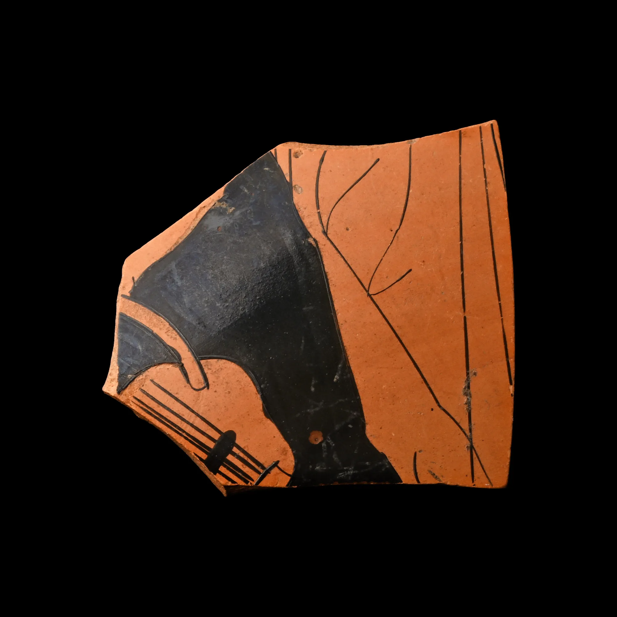 Attic red-figure kylix fragment showing a draped figure playing the lyre, early 5th century BC