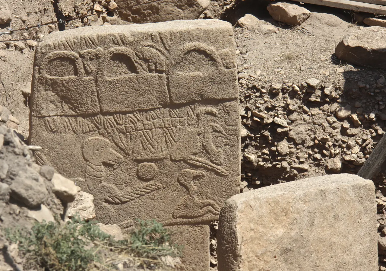Pillar 43 at Göbekli Tepe, with three looped shapes carved along its top edge