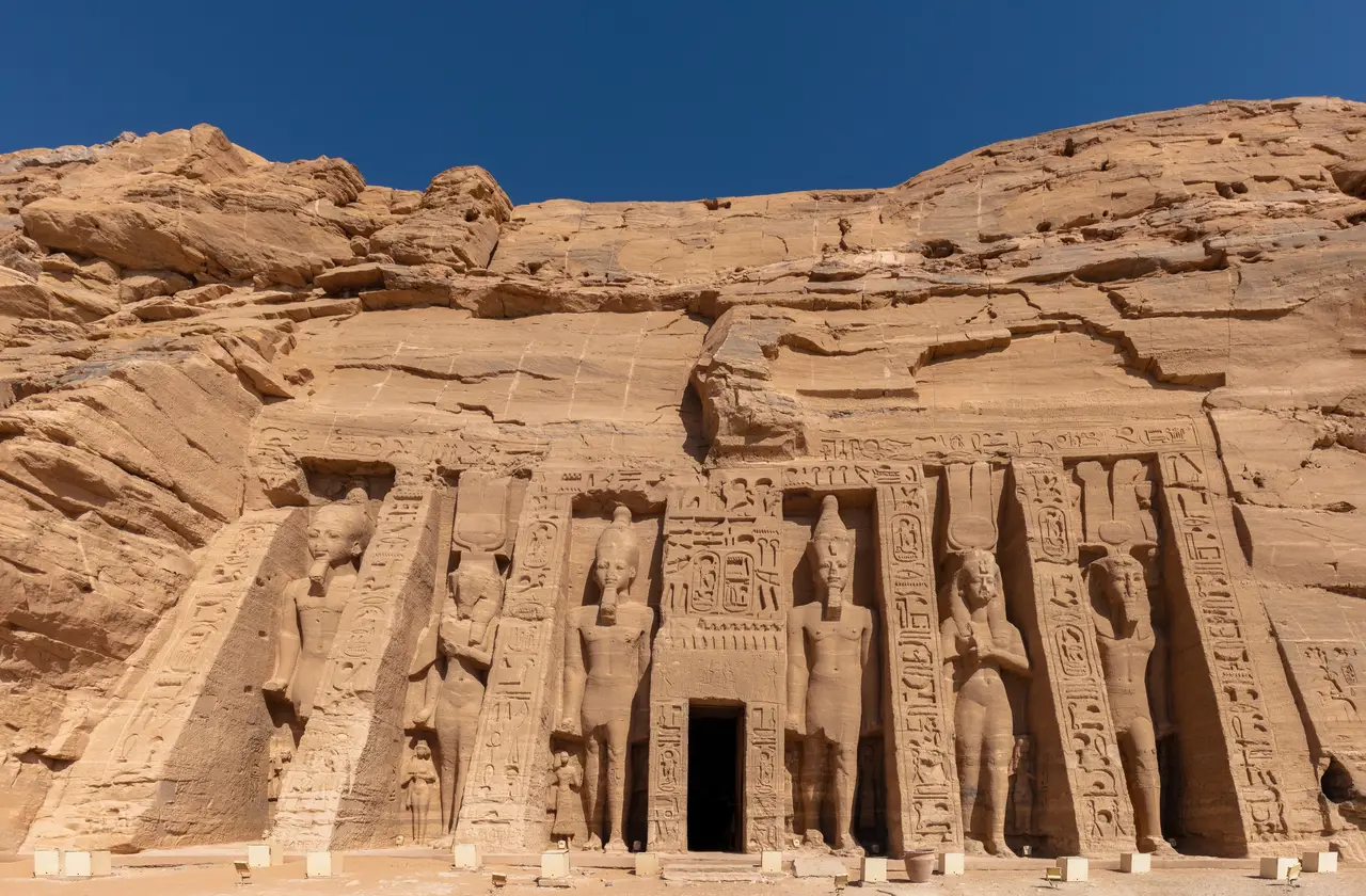 The rock-cut facade of the Small Temple at Abu Simbel, with its six colossi