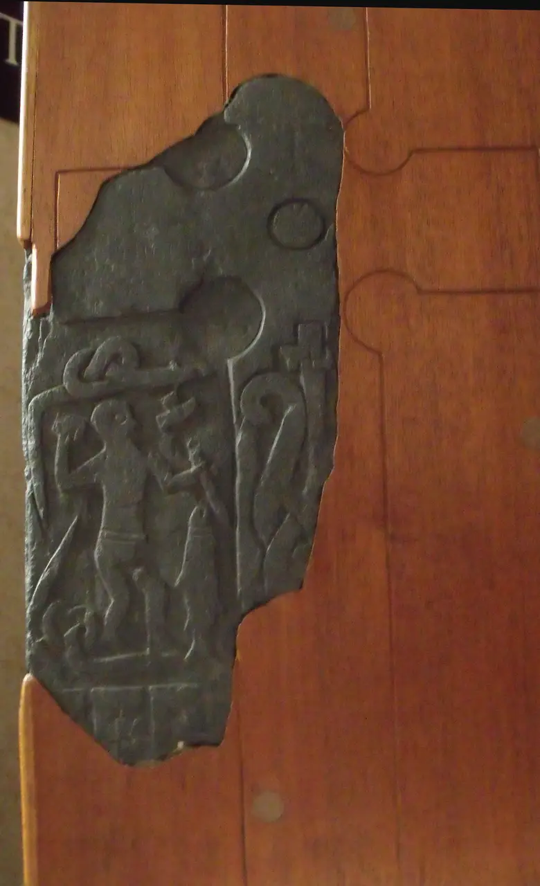 Odin devoured by the wolf Fenrir, carved on Thorwald's Cross at Kirk Andreas, Isle of Man