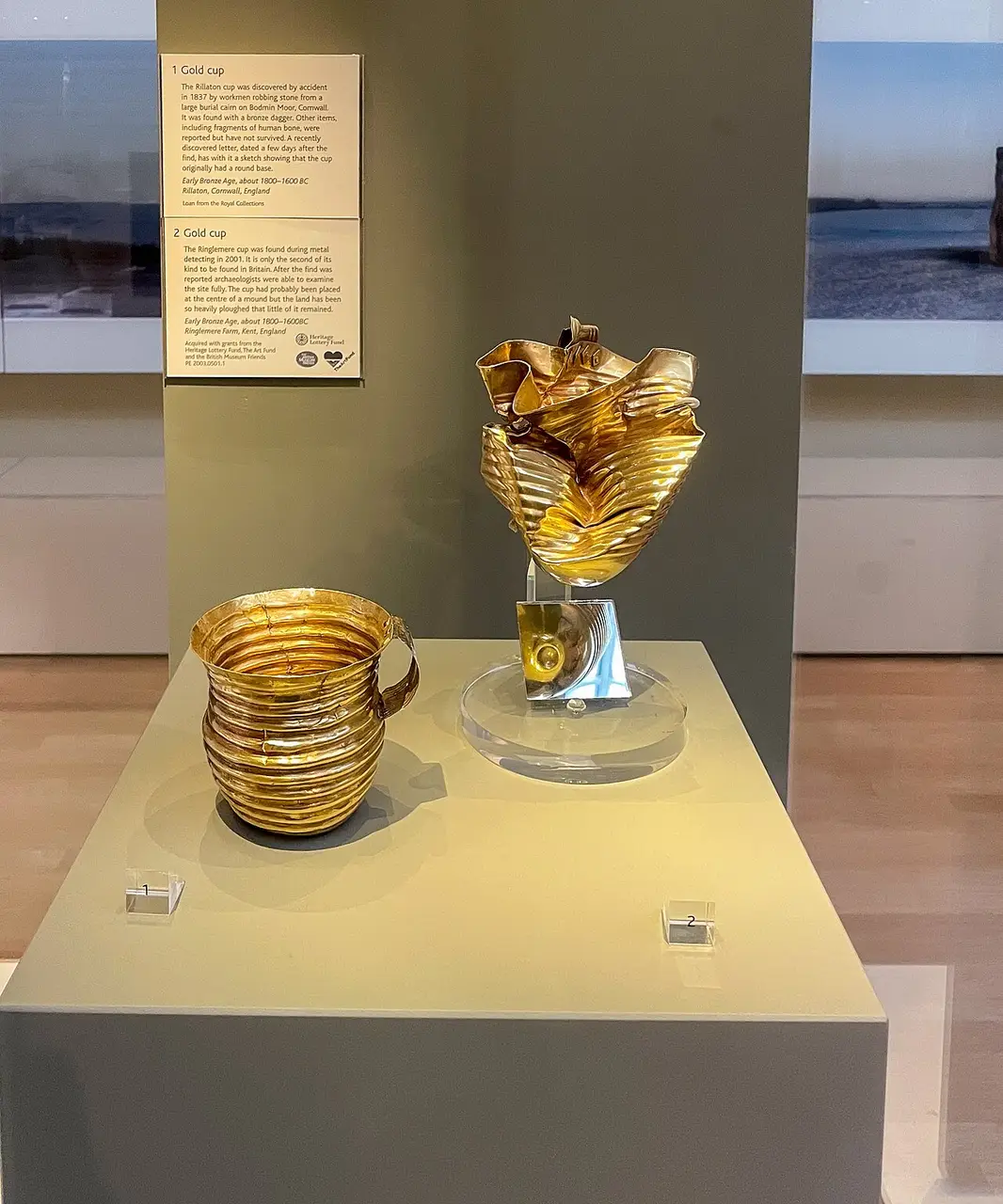 The crushed Ringlemere gold cup displayed beside the intact Rillaton cup at the British Museum
