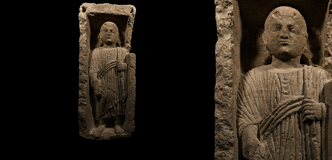 Romano-Egyptian Limestone Stele of a Nobleman Holding an Offering to the Gods