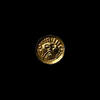 Anglo-Saxon Chip-Carved Saucer Brooch with Face of Woden