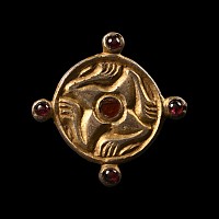 Merovingian Silver-Gilt Leg Whorl Brooch with Garnets