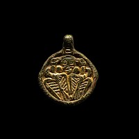 Viking Silver-Gilt Pendant with Odin Gripping Two Ravens