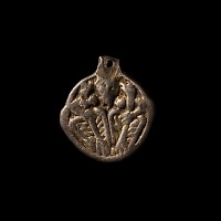 Viking Silver-Gilt Pendant with Odin Gripping Two Ravens