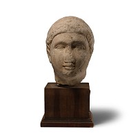 Cypriot Votive Limestone Head of a Young Man