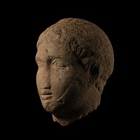 Cypriot Votive Limestone Head of a Young Man