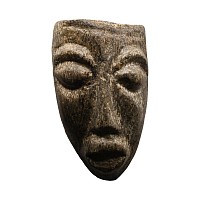 Natural History - Mastodon Bone Face Carving