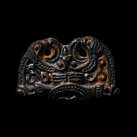Pre-Viking Gilt Bronze Fitting with Mask Between Ravens