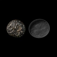 Mesopotamian Bronze Cylinder Seal with Double-Faced Demon Head