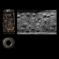 Anatolian Black Stone Cylinder Seal with Seated Figure Holding Cup Facing a Standing Figure