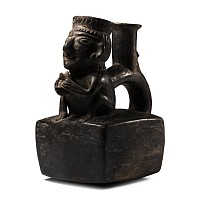Moche Painted Pottery Stirrup Jar with Crouching Figure