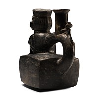 Moche Painted Pottery Stirrup Jar with Crouching Figure