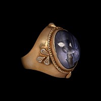 Large Gold-Coloured Metal Ring with Ancient Sapphire Bead