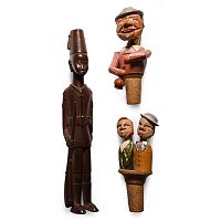 Wooden Figure and Articulated Figural Bottle Stop Group